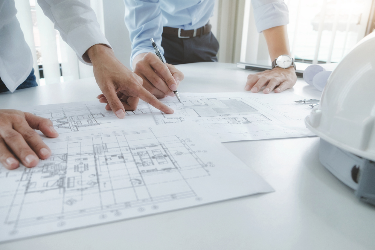 Engineer meeting for architectural project. working with partner Image of engineer meeting for architectural project. working with partner and engineering tools on workplace vintage tone.